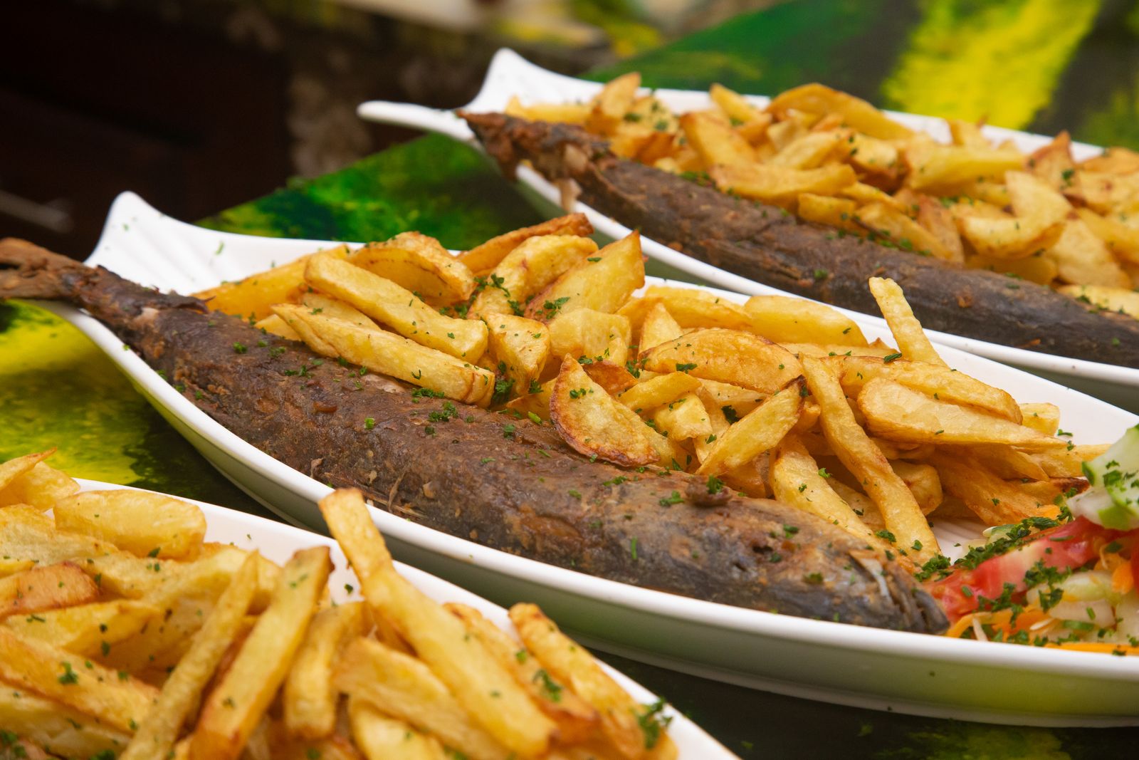 Golden crispy fried fish served with fries
