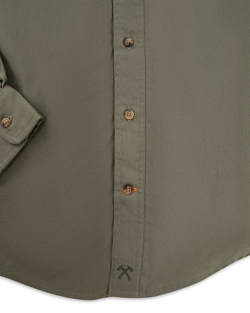 Crossed tomahawk logo on the lower placket of the Jack Carr Hunters Shirt