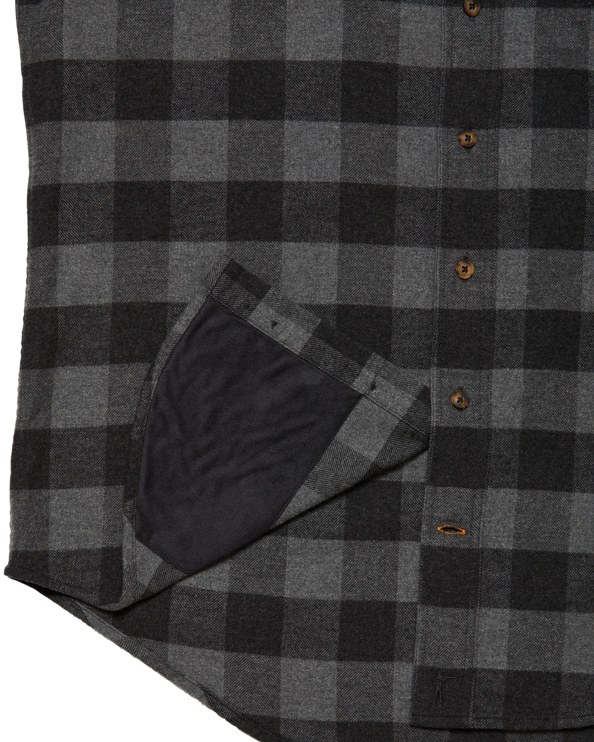 Microfiber sunglass cloth at the hem of the Grey Buffalo Plaid shirt