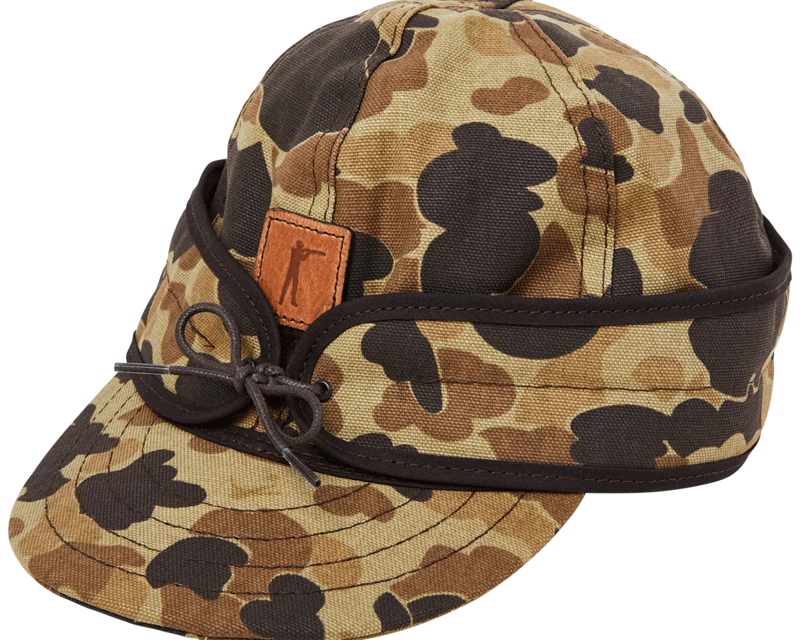 Stormy Kromer x Ball and Buck Insulated Cap in Original Camo, side view with leather patch and tie