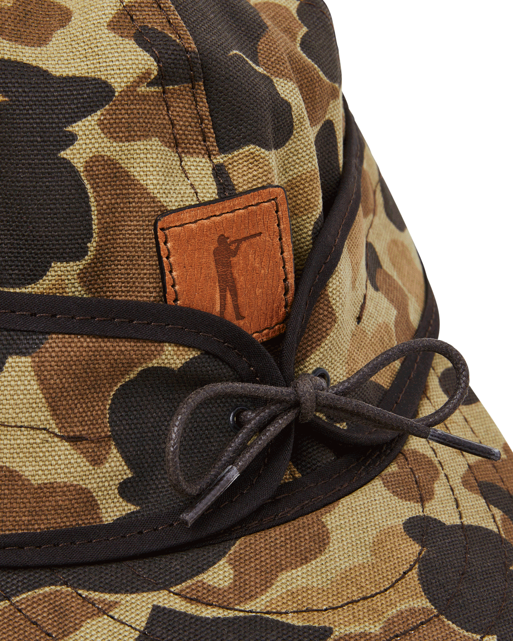Leather Arthur patch and cord tie on the Original Camo Stormy Kromer cap