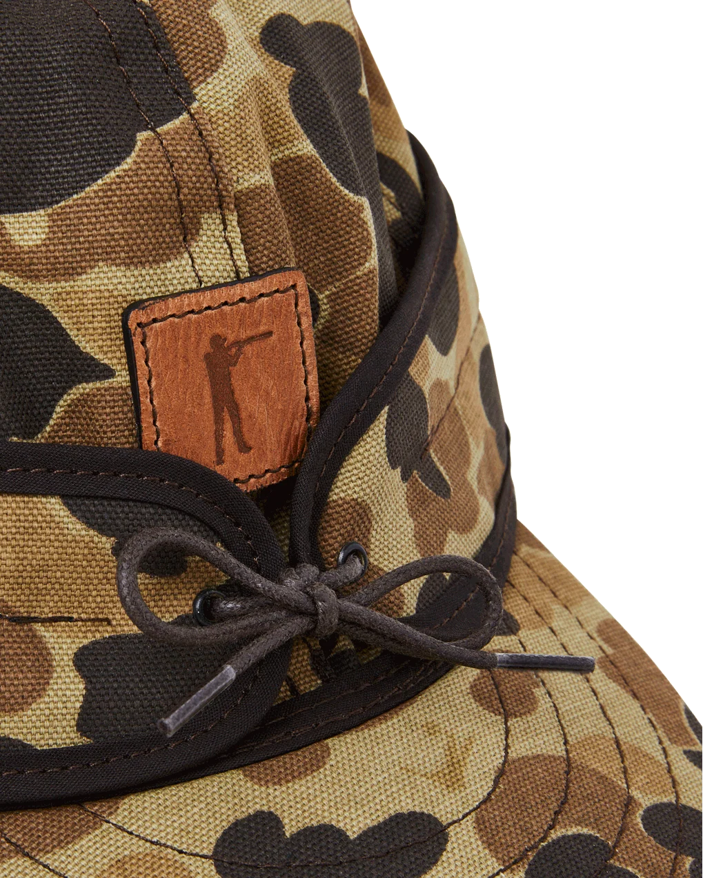 Leather Arthur patch and rope tie on the Original Camo insulated Stormy Kromer cap