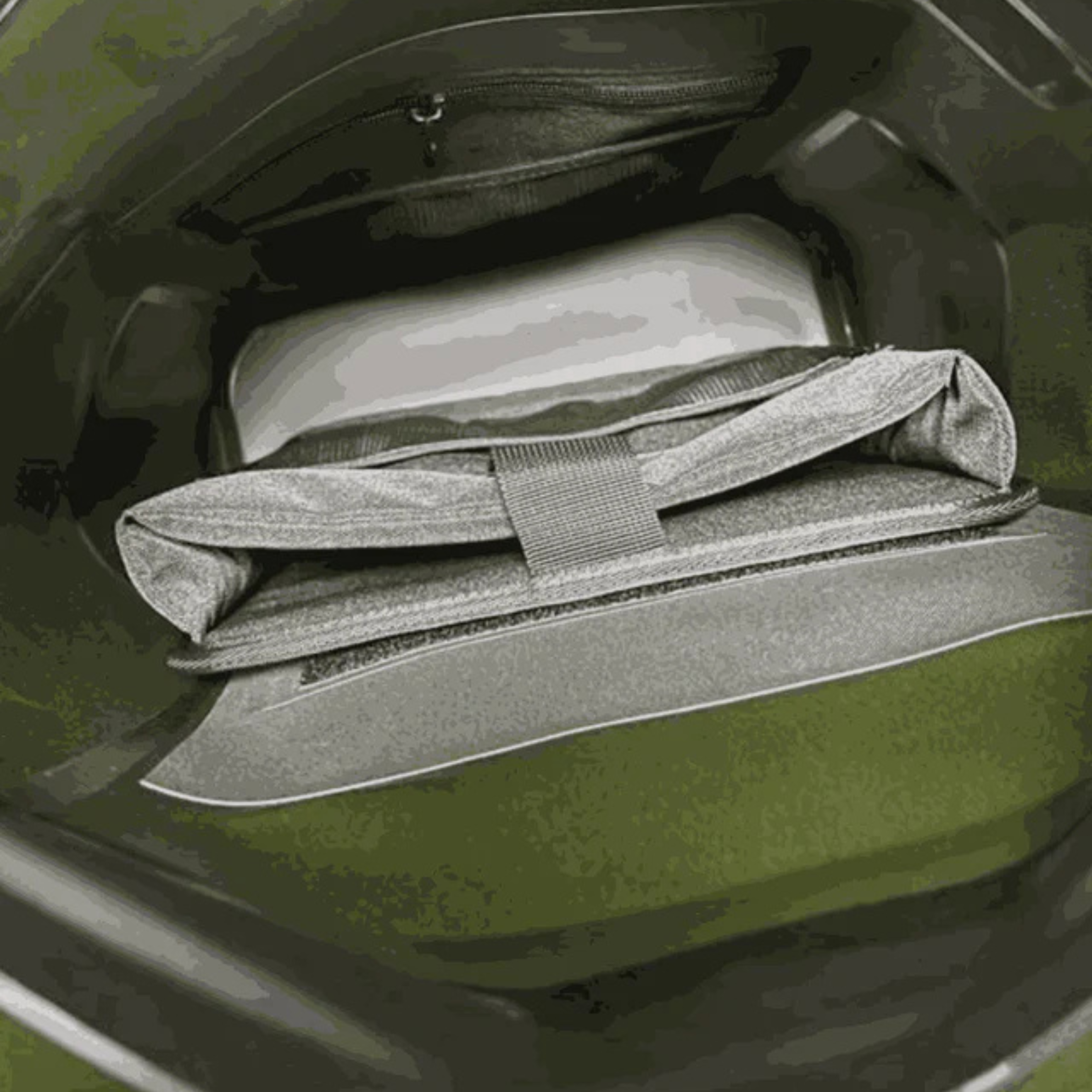 Olive green tactical gear bag with internal pockets and compression straps for hunting or outdoor use