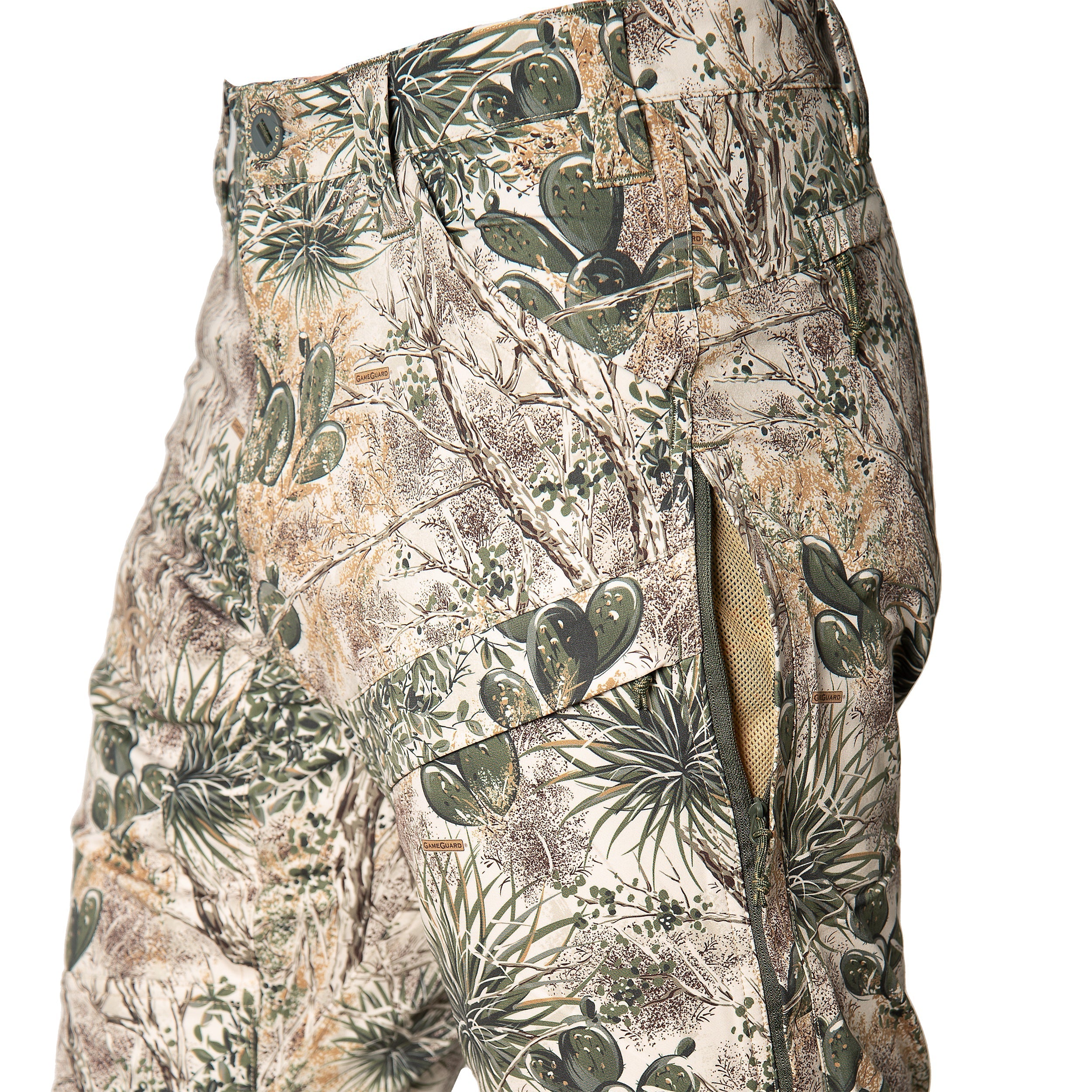 GameGuard desert camo hunting pants with cactus print, zippered pockets, and durable fabric for outdoor use
