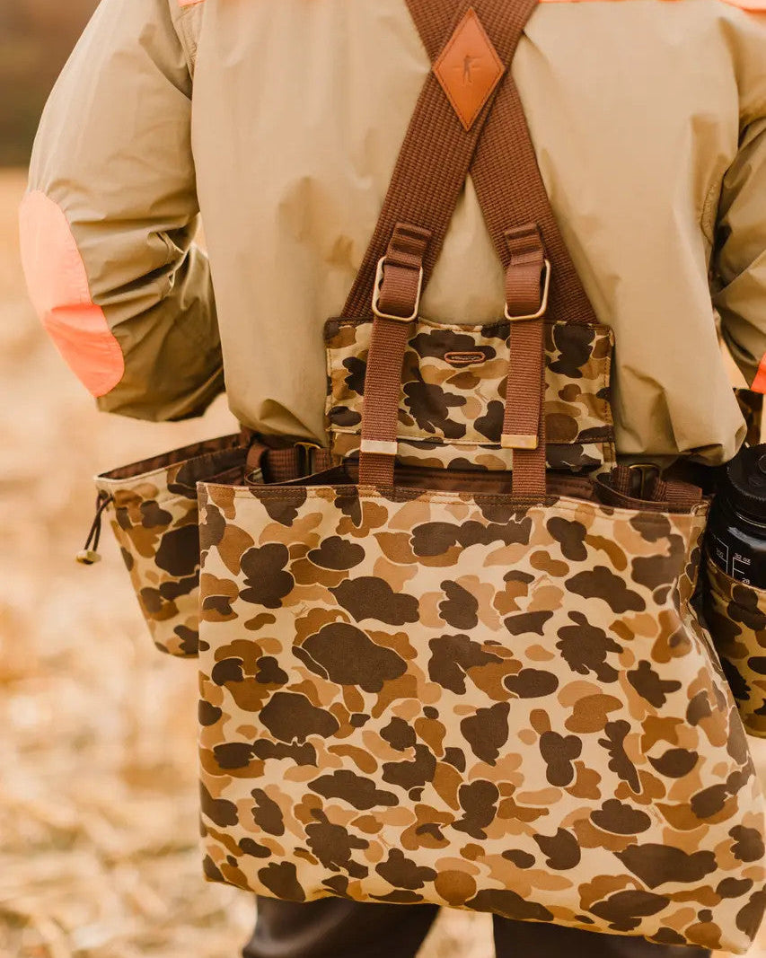 Back of the Original Camo Strap Vest worn over a khaki field shirt