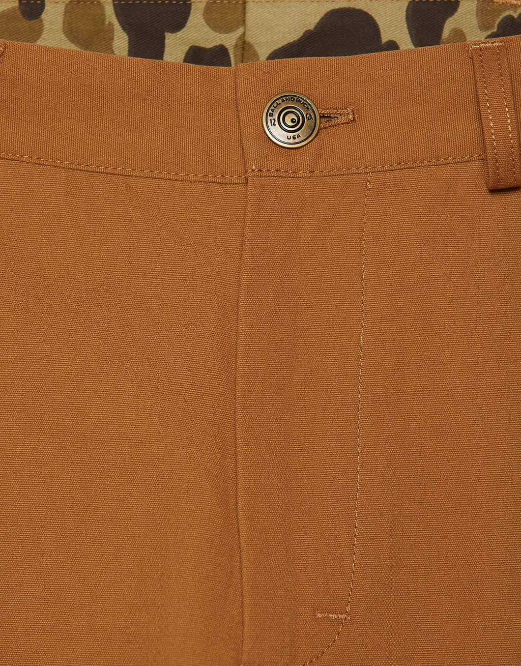 Brass shank button on the Ground Nutmeg Heritage Pant