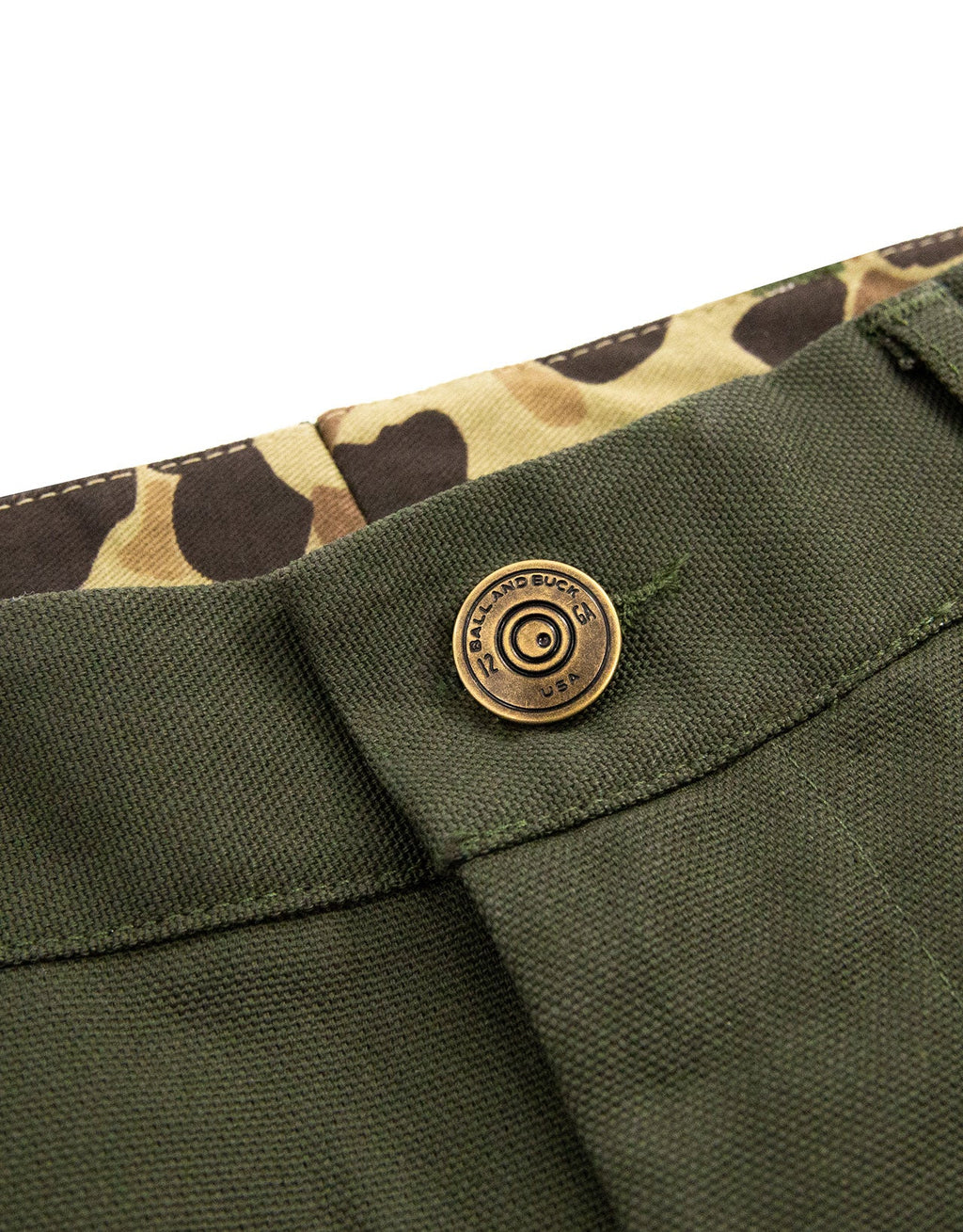 Shotgun shell brass shank button and camo pocket lining on the Pine Duck Field Pant