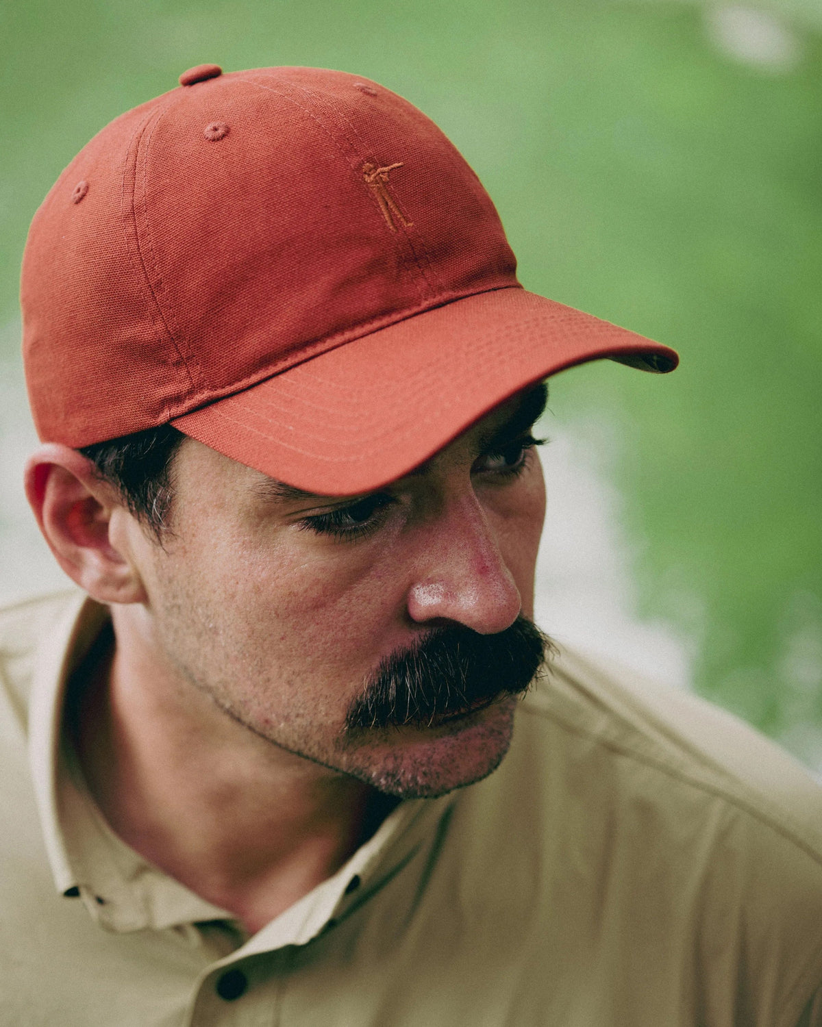 Man wearing the Burnt Orange Arthur Core Hat outdoors