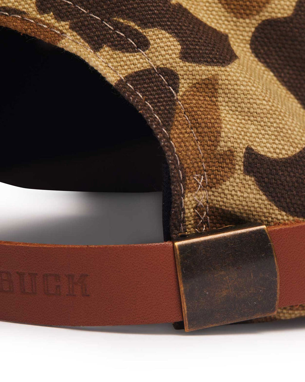 Adjustable leather strap with antique brass clasp on the Arthur Field Hat