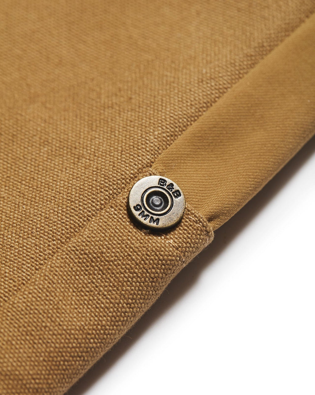 Shotgun shell brass button on the Active+ Field Pant