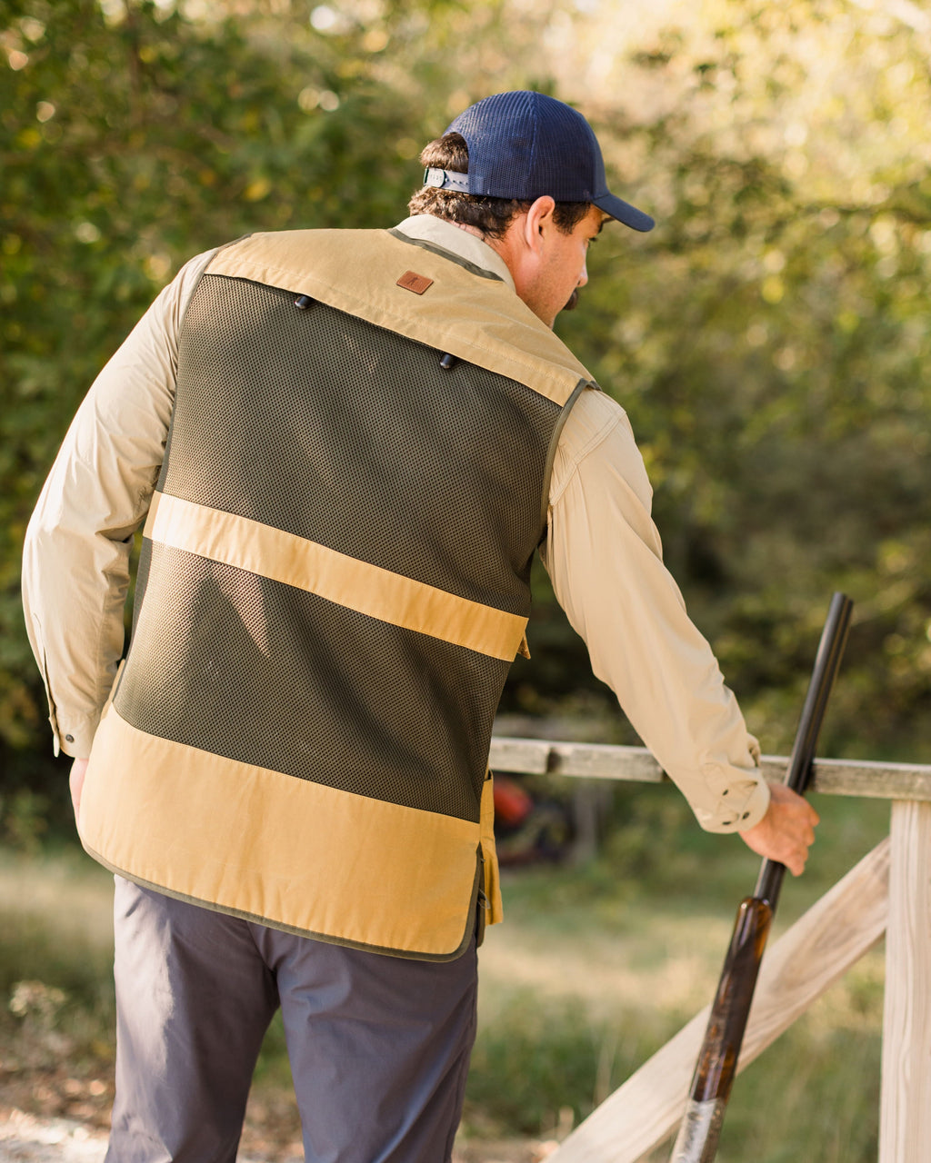 Heritage Clays Vest from behind while the shooter walks a clays course