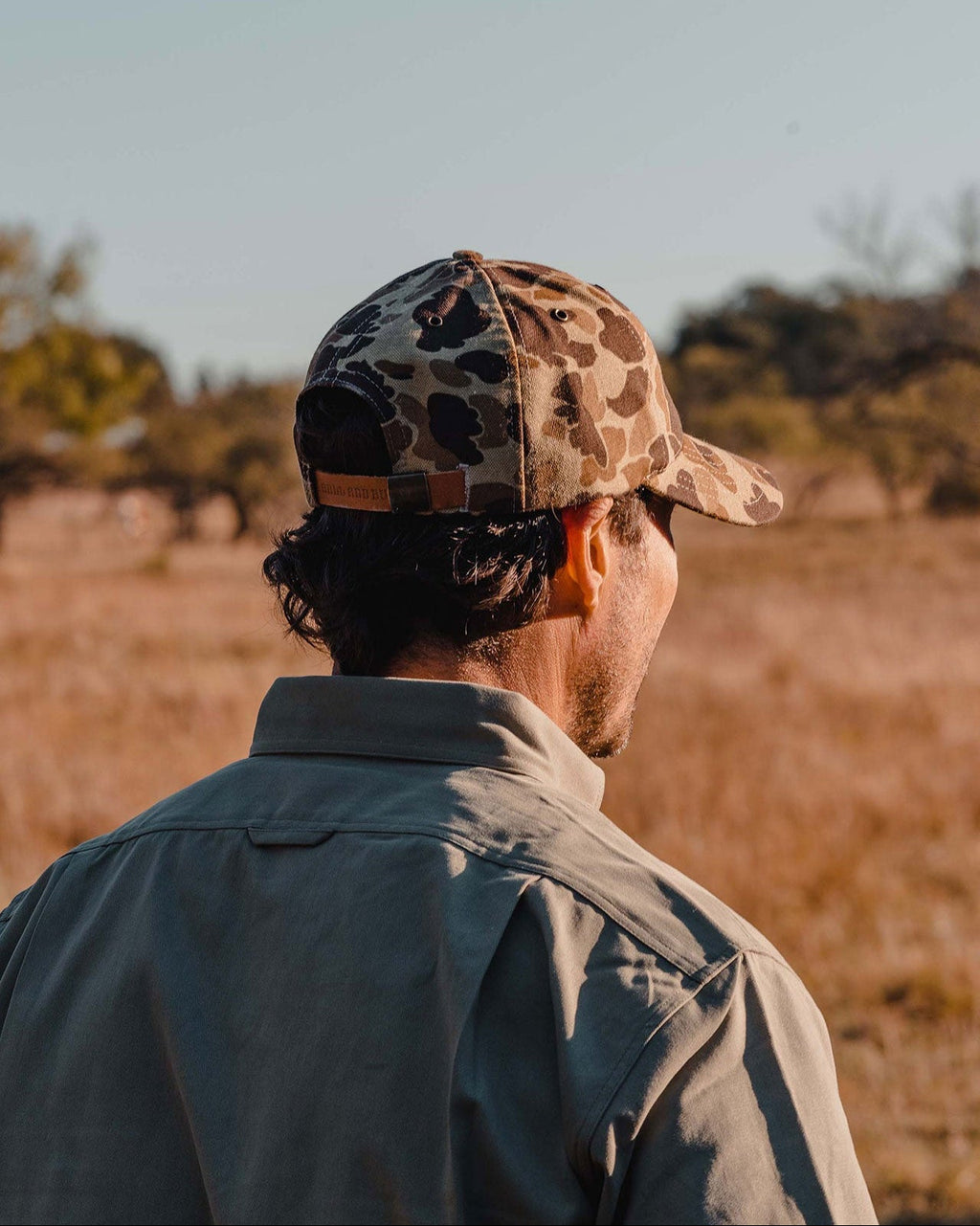 Original Camo Arthur Field Hat worn, back view in open country