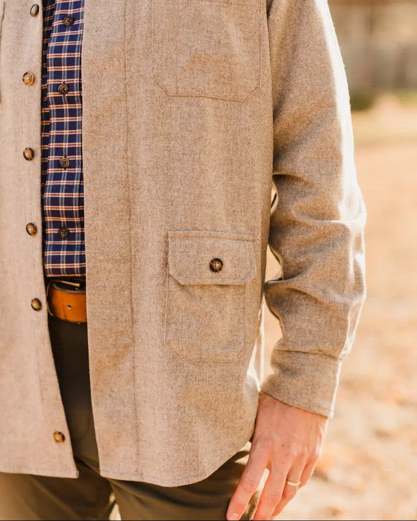 Waist pocket on the Oatmeal Mariners Overshirt worn over a plaid shirt