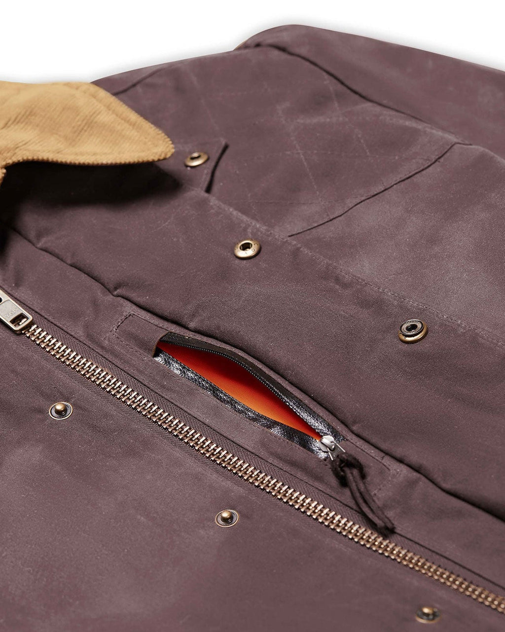 Weather shield hidden pocket with blaze orange liner on the Dark Oak Upland Jacket