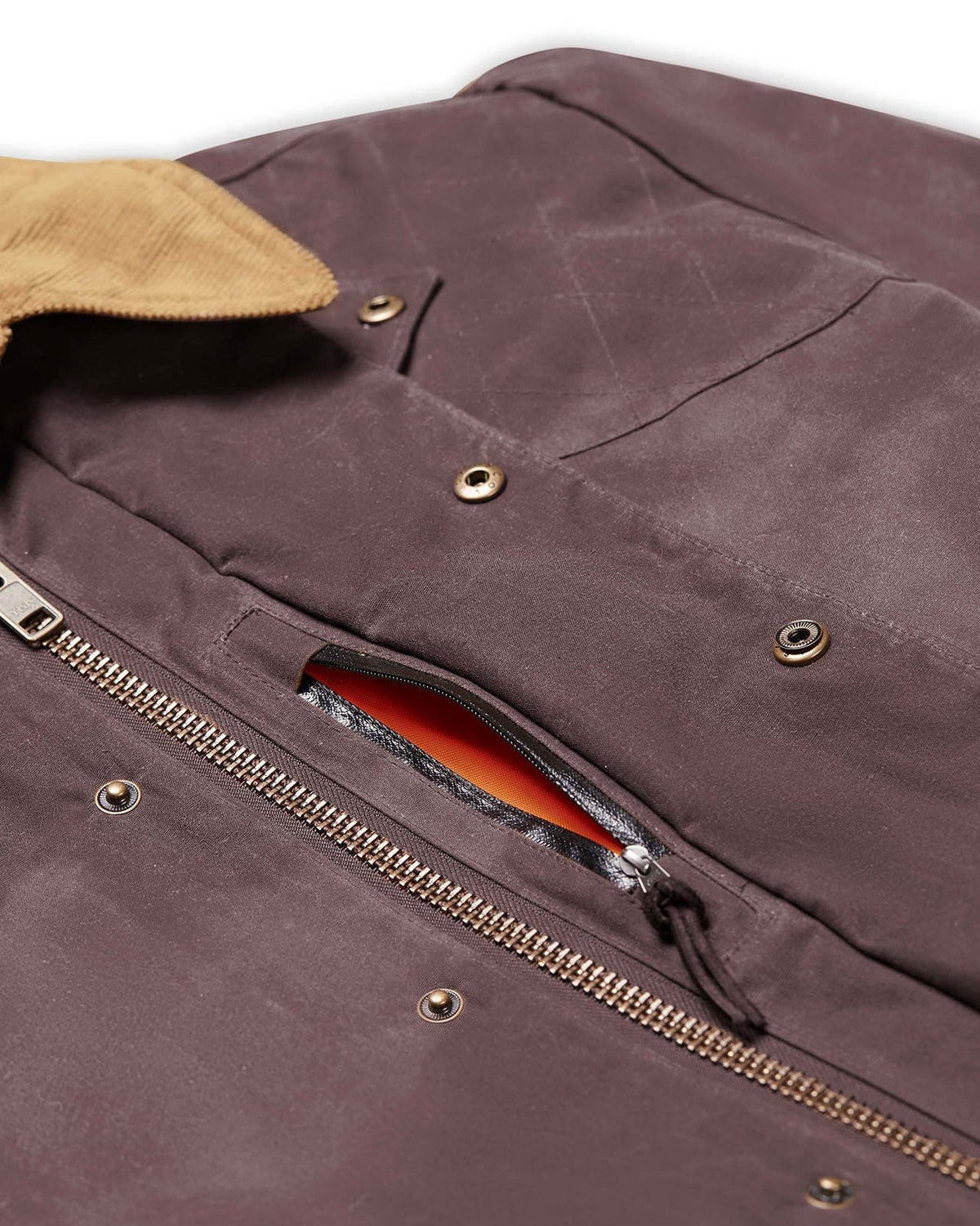 Weather shield hidden pocket with blaze orange liner on the Dark Oak Upland Jacket