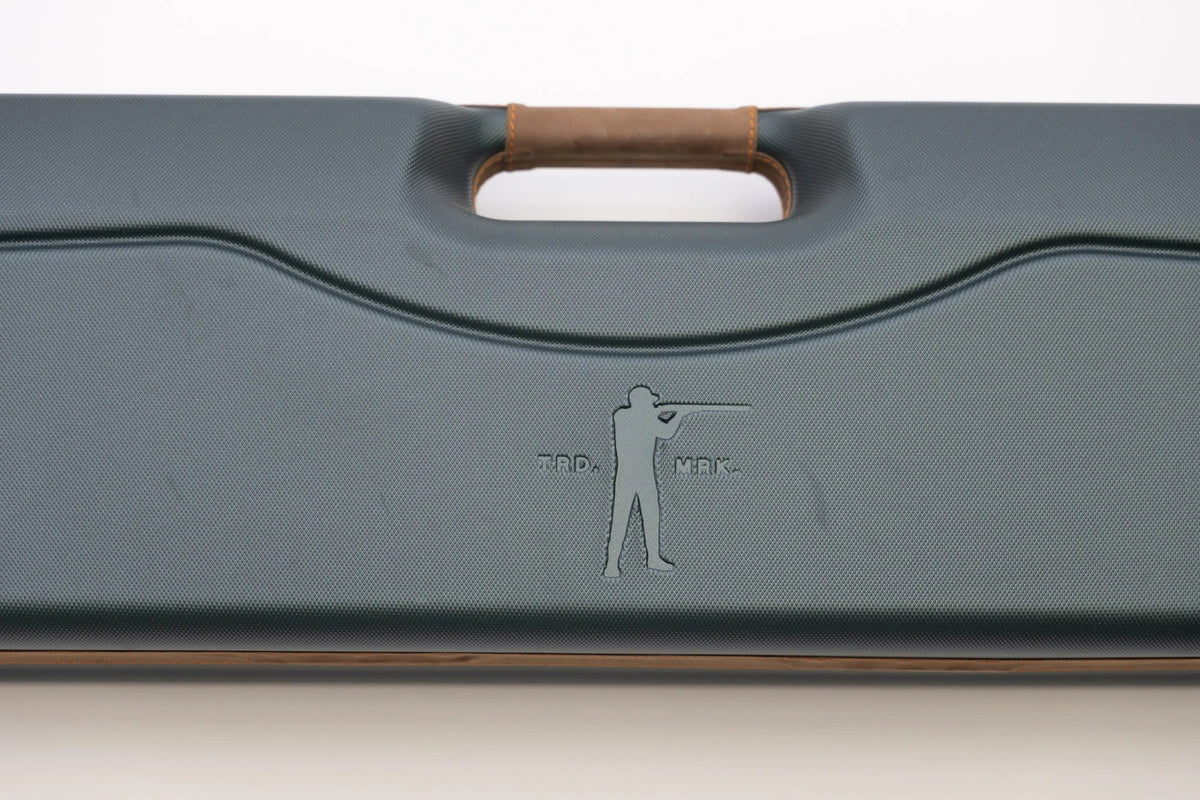 Close-up of the green ABS shell and embossed Arthur logo on the Negrini shotgun case