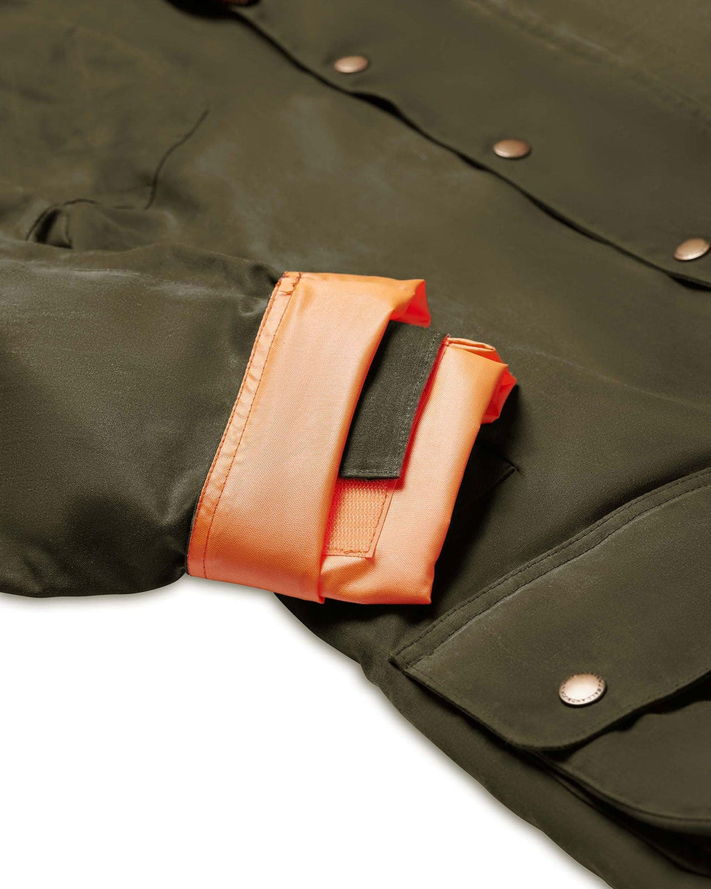Blaze orange lined tab cuff on the Olive Upland Jacket