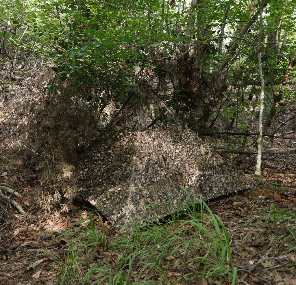 Leafy camouflage hunting blind in dense forest for deer and turkey hunting