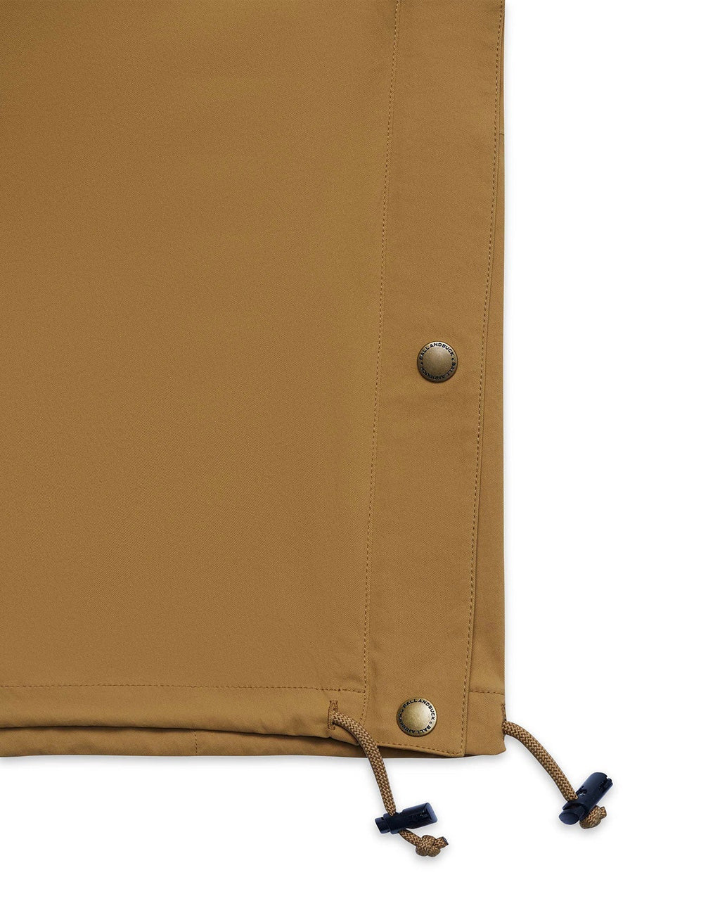 Waist drawstring toggle on the tan Active+ Anorak