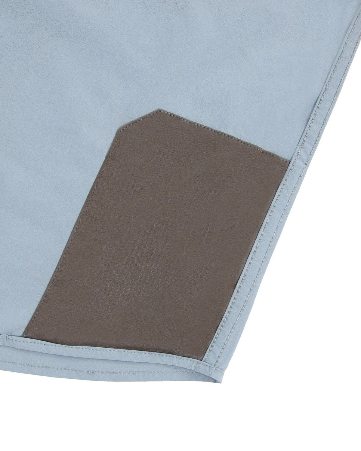 Microfiber lens cloth at the hem of the Sky Blue Active+ Guide Shirt
