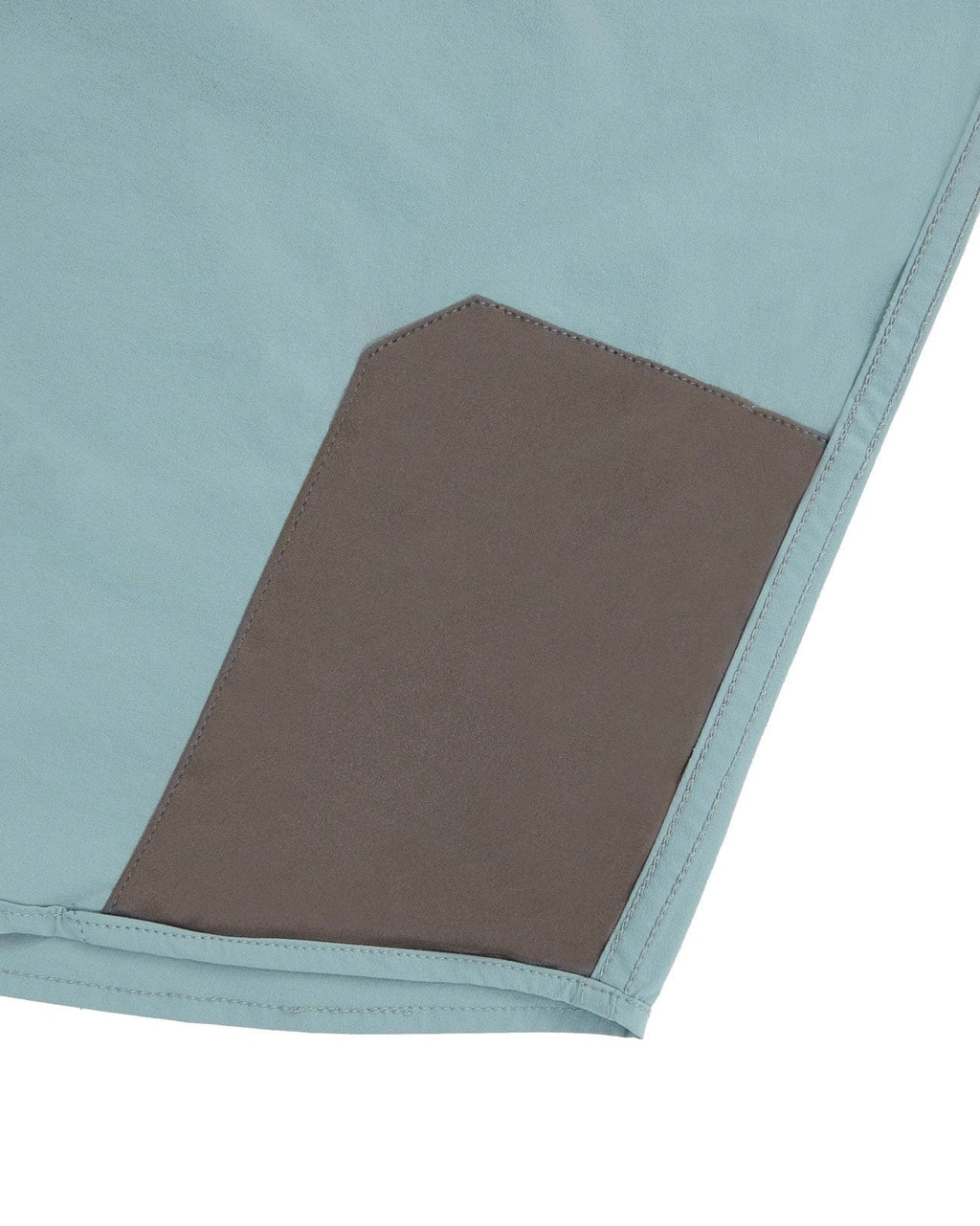 Microfiber lens cloth at the hem of the River Green Active+ Guide Shirt