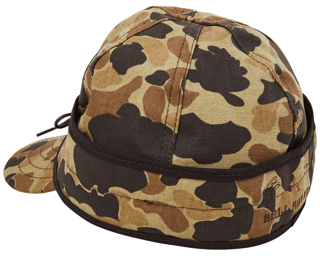 Insulated Stormy Kromer x Ball and Buck cap with the ear band pulled down