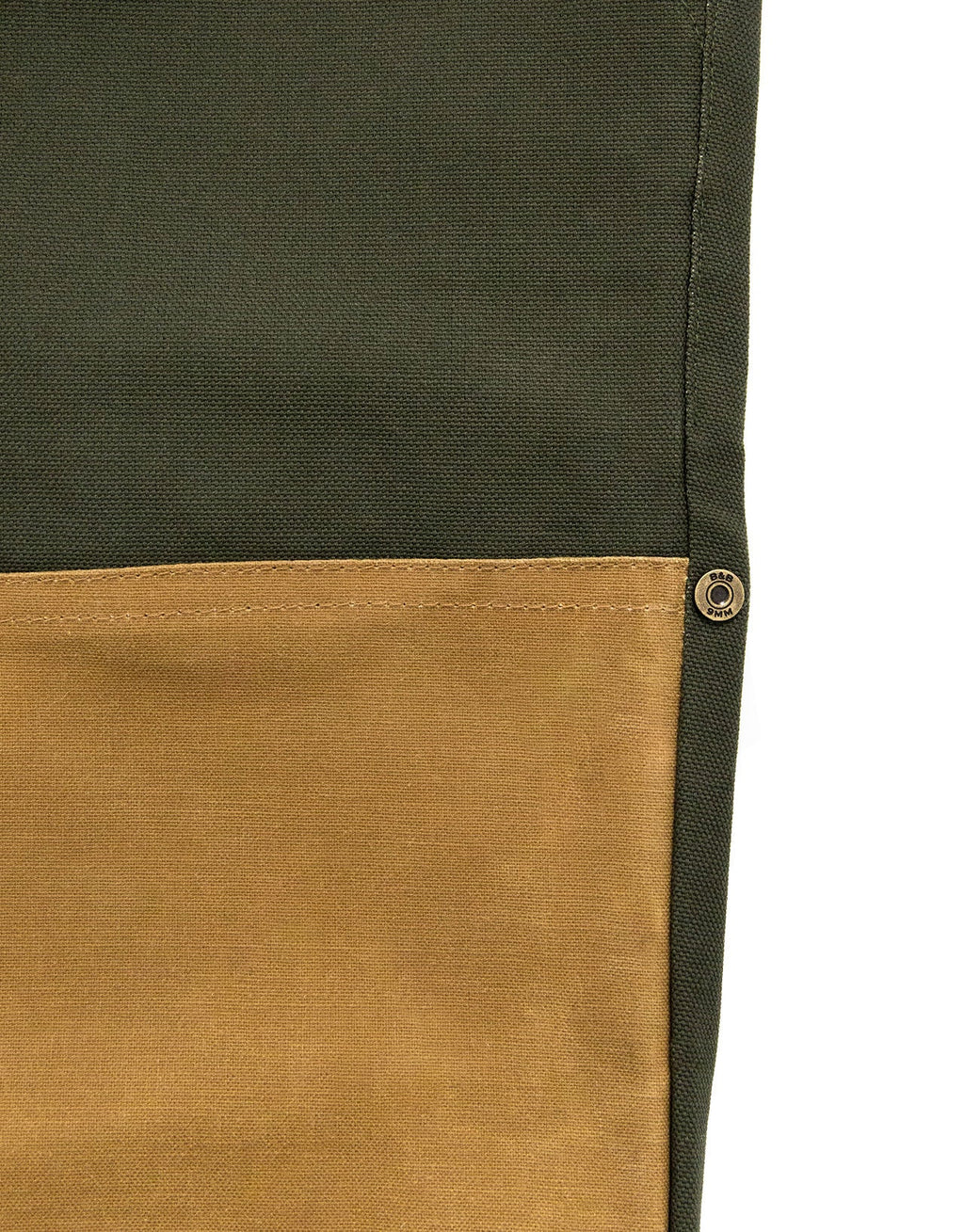 Seam where green duck canvas meets the tan waxed cotton leg on the Pine Duck Field Pant