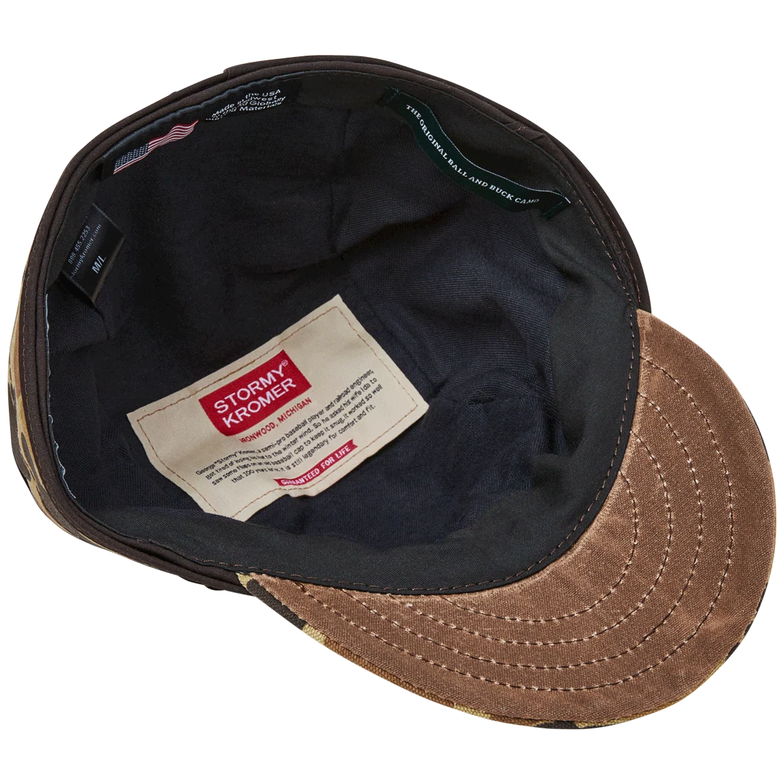 Underside of the Original Camo Stormy Kromer cap showing flannel lining and labels