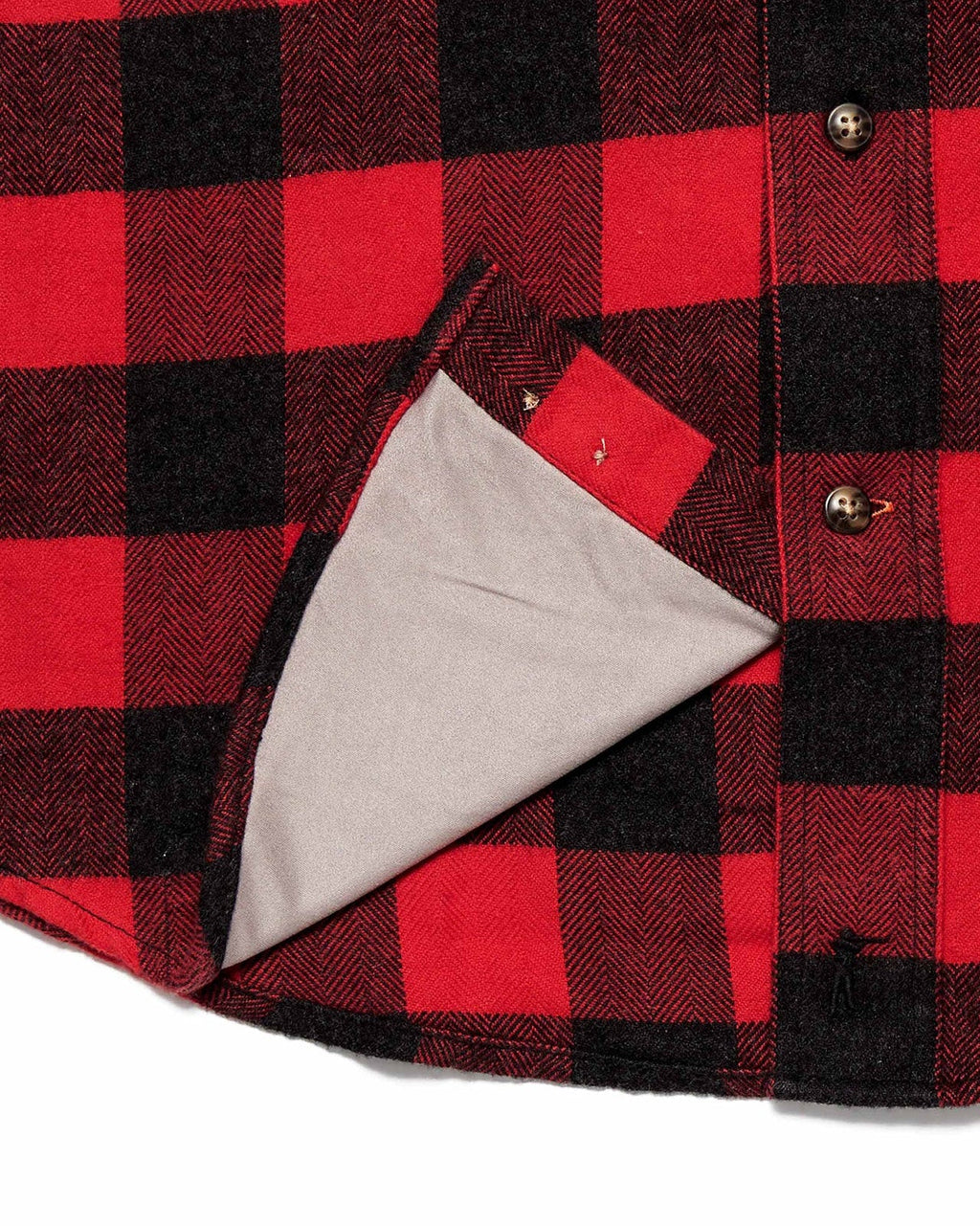 Microfiber sunglass cloth at the hem of the red Buffalo Plaid Sportsmans Shirt