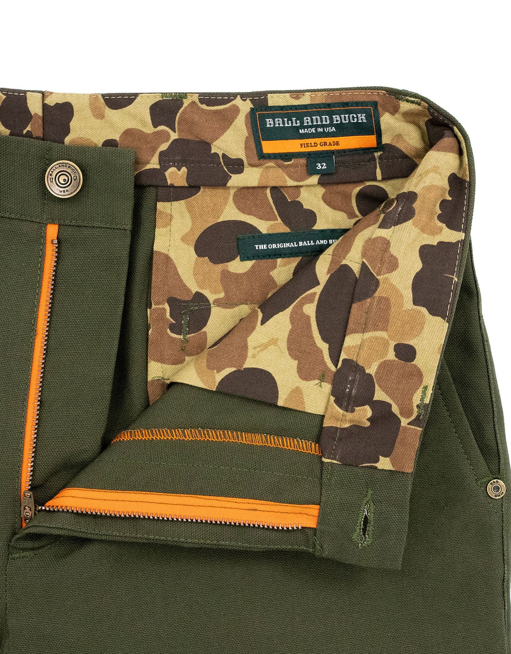 Inside waistband with camo lining and blaze orange zipper tape on the Pine Duck Field Pant