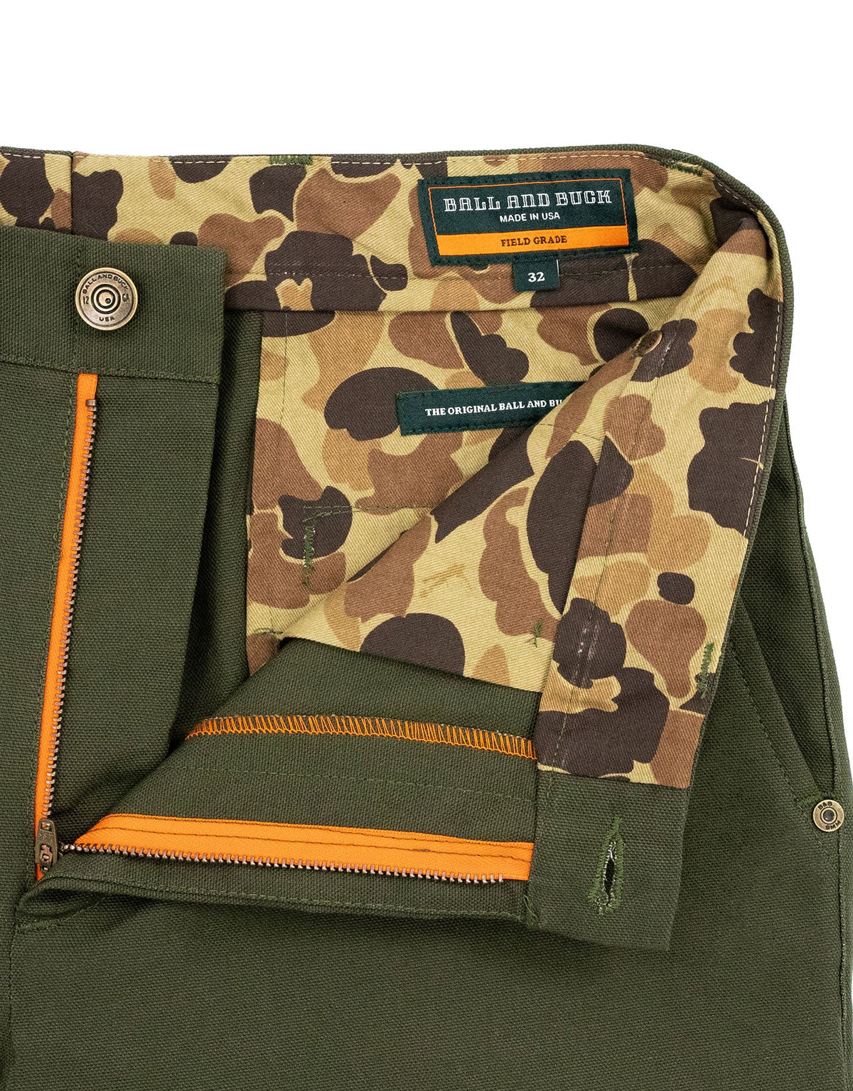 Inside waistband with camo lining and blaze orange zipper tape on the Pine Duck Field Pant