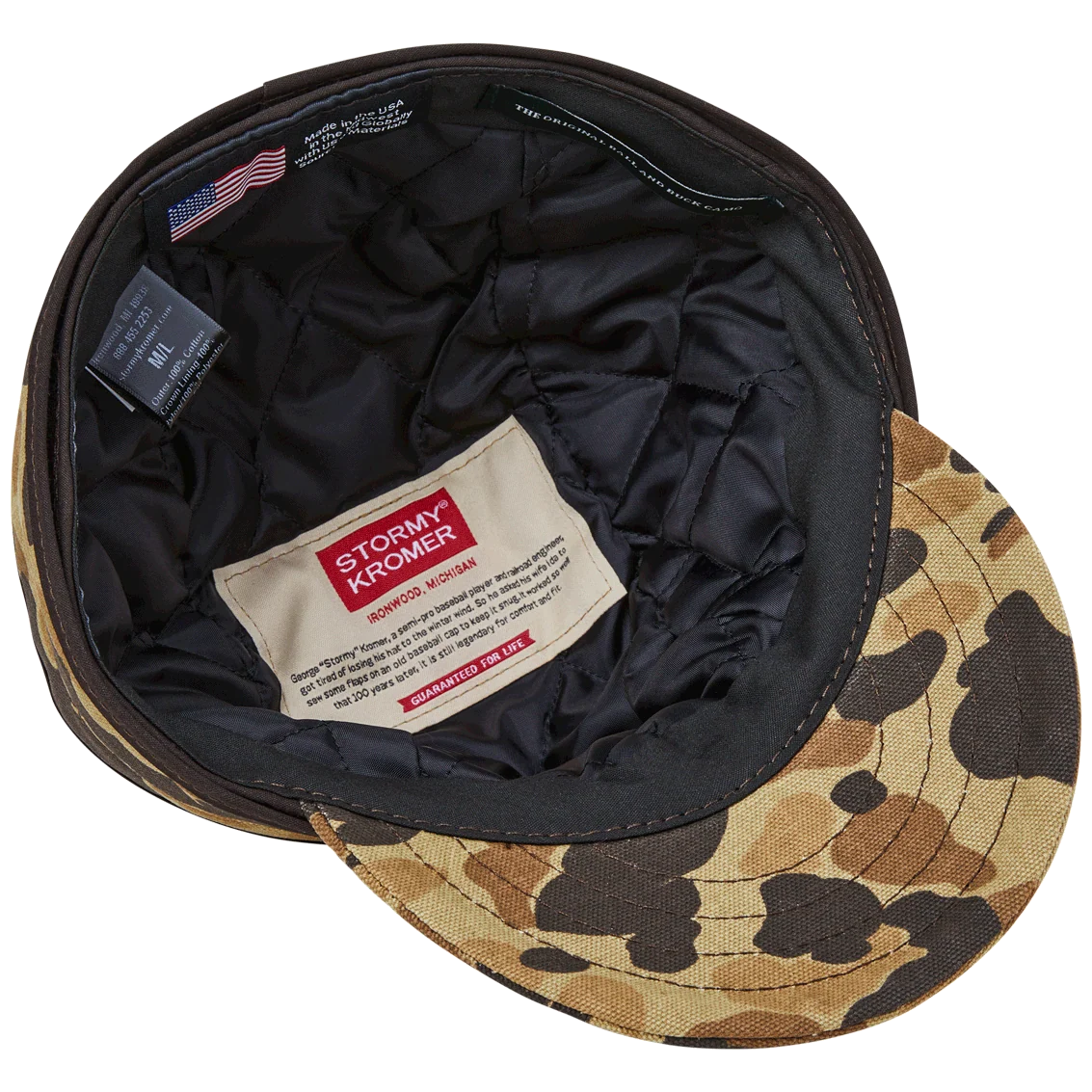 Underside of the insulated Stormy Kromer cap showing black quilted lining and labels