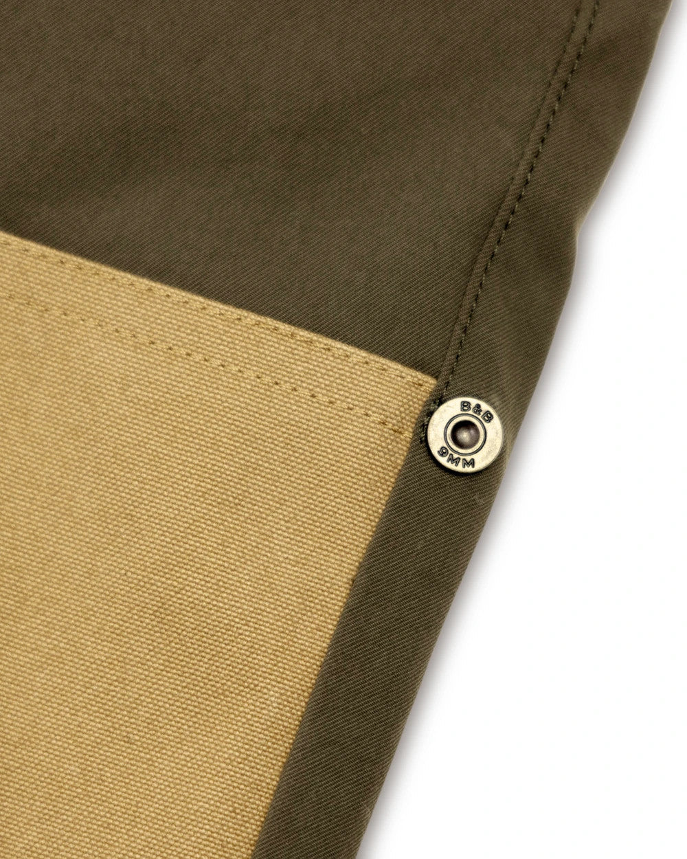 Brass rivet where the canvas panel meets the stretch fabric on the Loden Joan pant