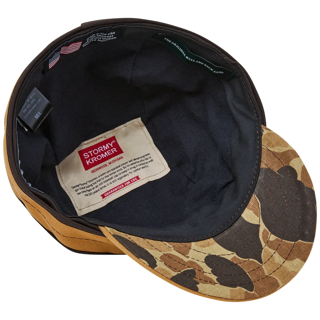 Underside of the Signature Canvas Stormy Kromer cap showing Original Camo under the brim and flannel lining