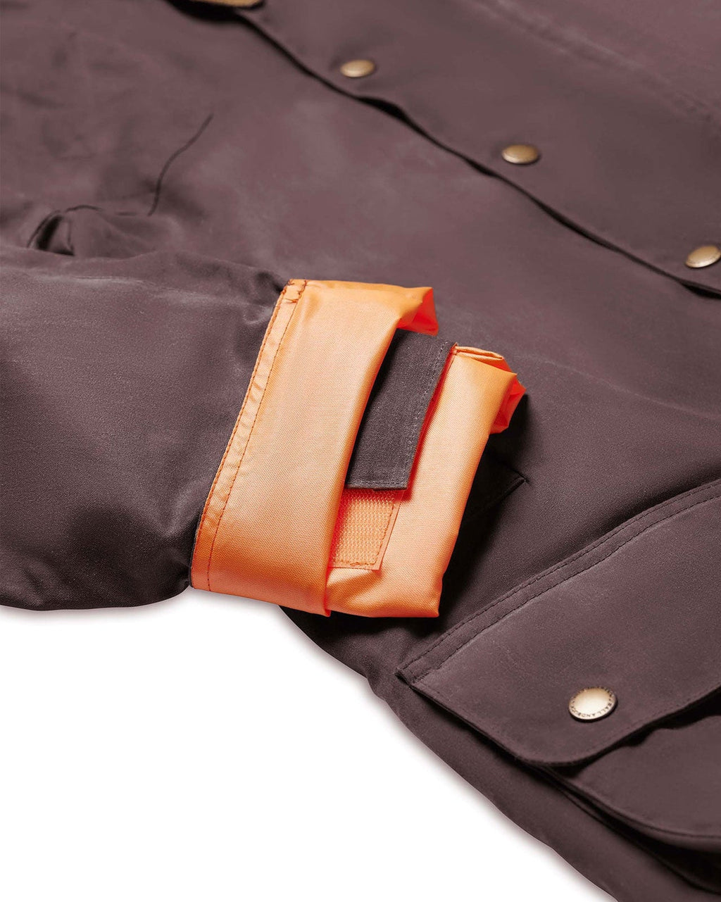 Blaze orange lined adjustable tab cuff on the Dark Oak Upland Jacket