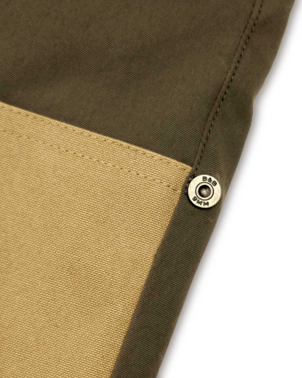 Brass rivet where the canvas reinforcement meets the stretch fabric on the Loden Active+ Field Pant