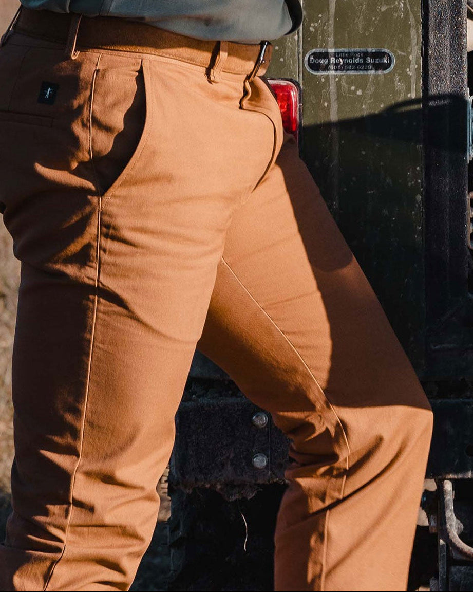Heritage Pant worn next to a truck, side view of the leg