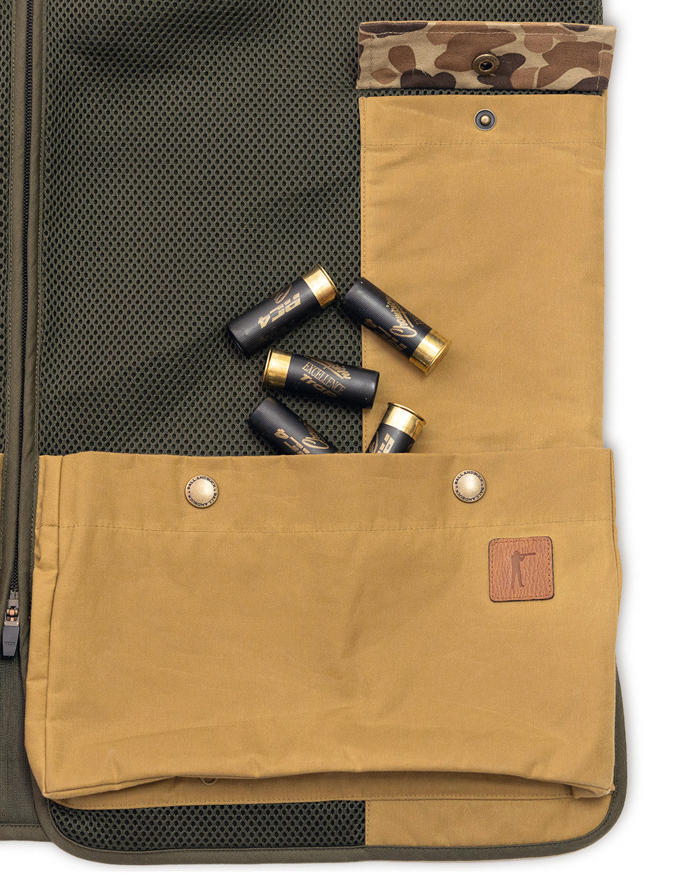 Heritage Clays Vest shell pocket with easy-empty bottom zipper and spent hulls