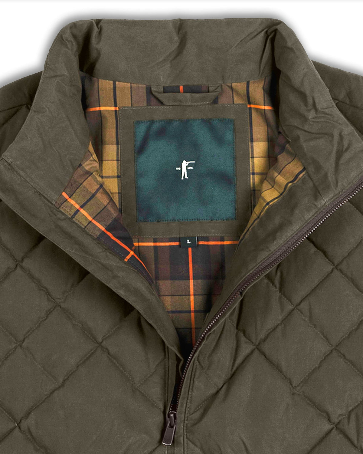Open collar of the Loden Arthur Down Vest showing the Ball and Buck plaid lining