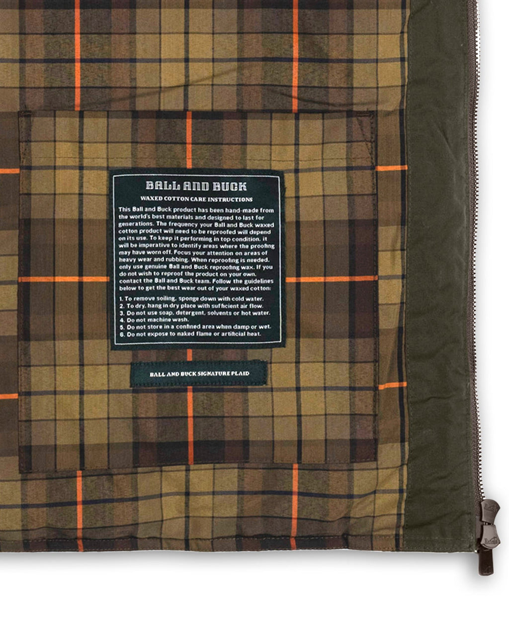 Interior stash pocket and label on the plaid lining of the Arthur Down Vest