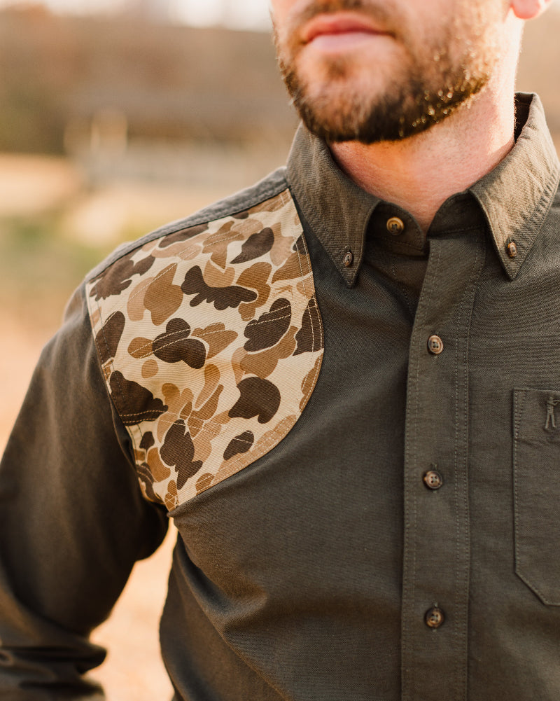 Original Camo shooting shoulder patch on the Moss Oxford Sportsmans Shirt, worn