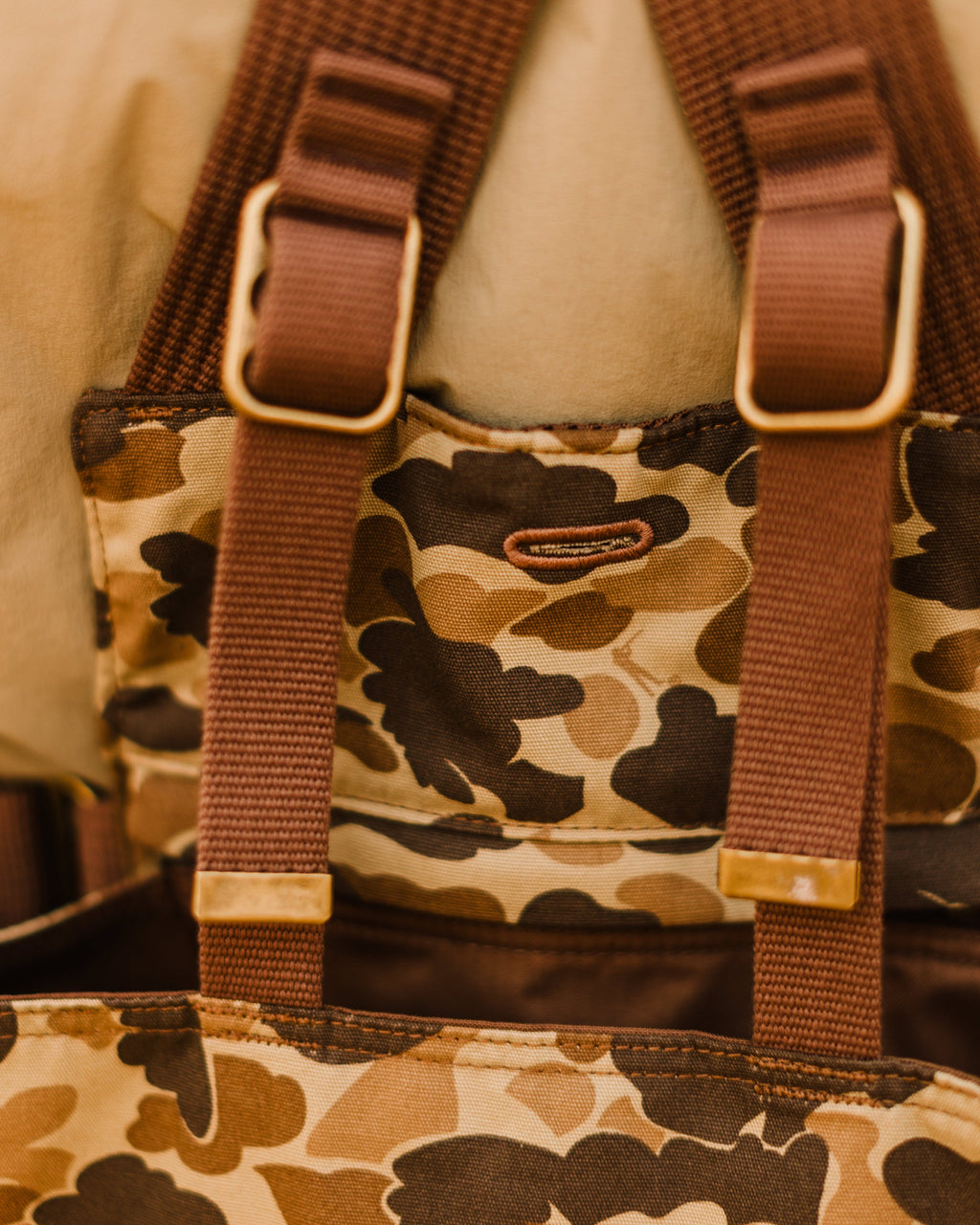 Brass hardware where the straps meet the game pocket on the Original Camo Strap Vest