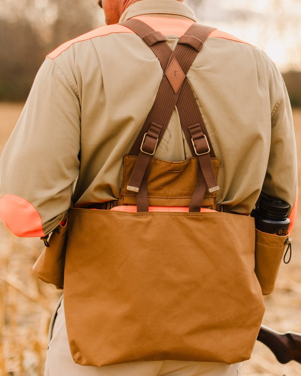 Signature Canvas Strap Vest worn from behind with the game pocket loaded
