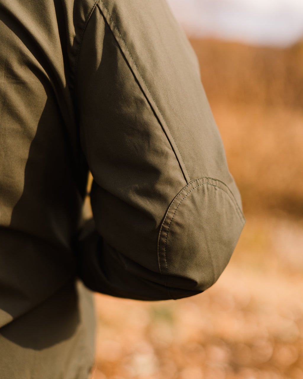 Integrated elbow patch on the Sage Green Harrington Jacket, worn