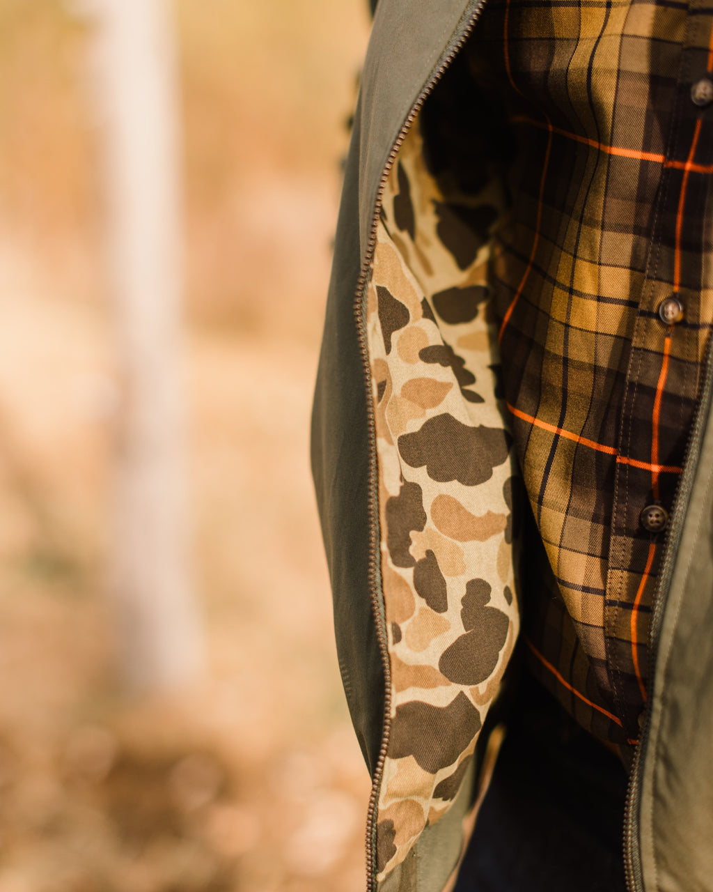 Original Camo lining visible inside the open Sage Green Harrington Jacket