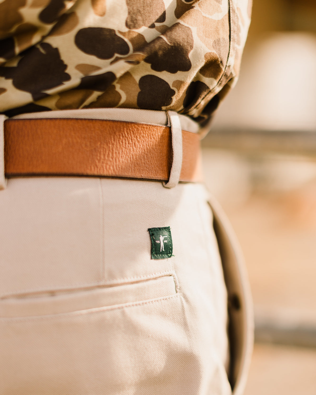 Signature Leather belt worn with an Original Camo shirt and khaki pants