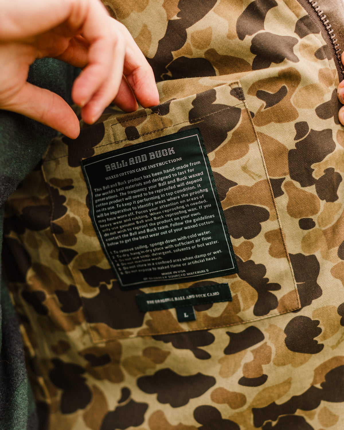 Care label stitched inside the camo lining of the Upland Vest