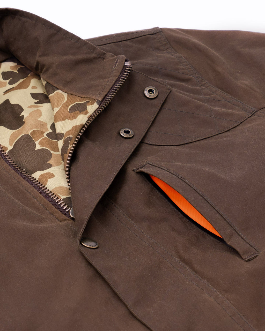 Collar and blaze orange lined hand warmer pocket on the Oak Waxed Field Jacket