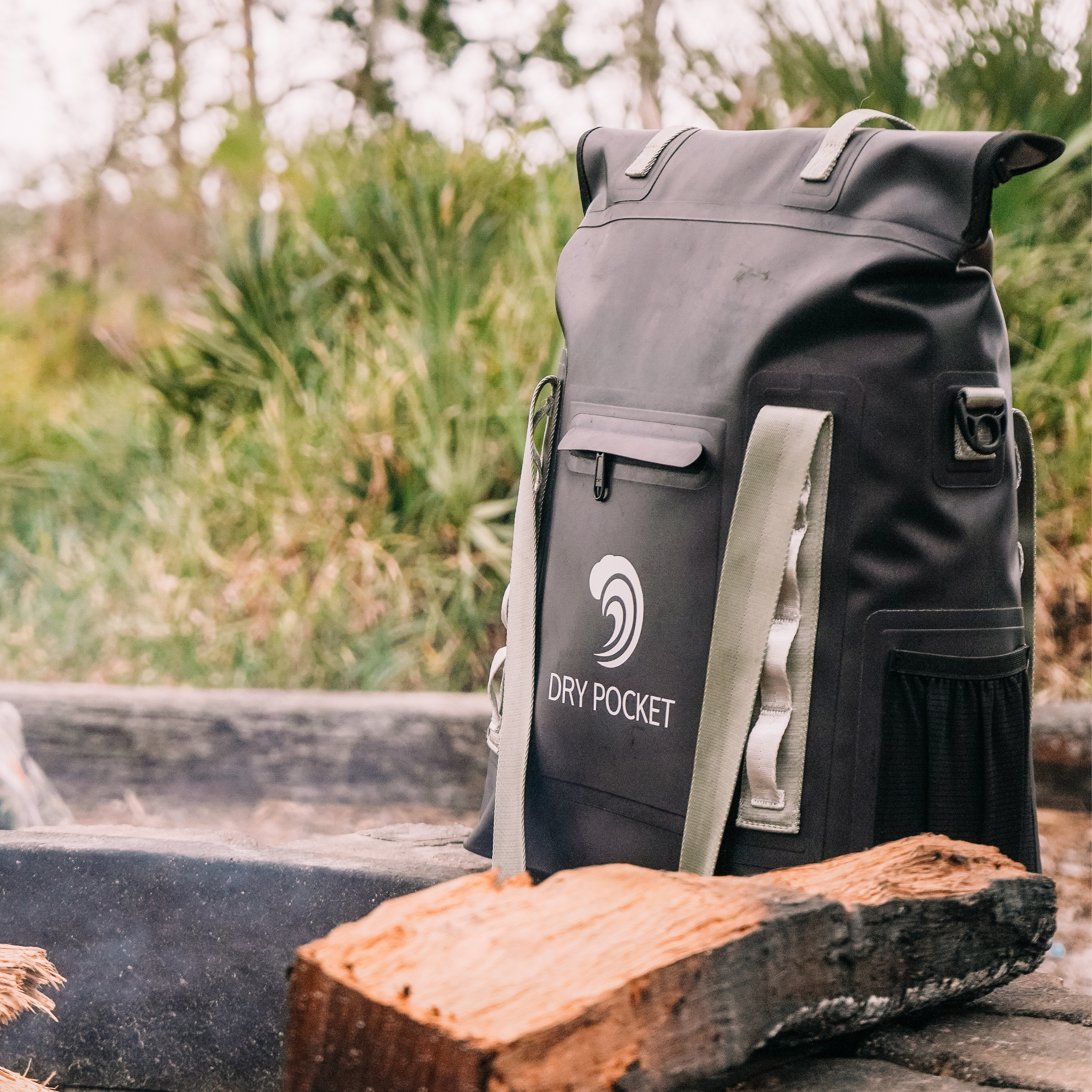 Black waterproof dry pocket backpack with olive straps, ideal for hunting and outdoor adventures