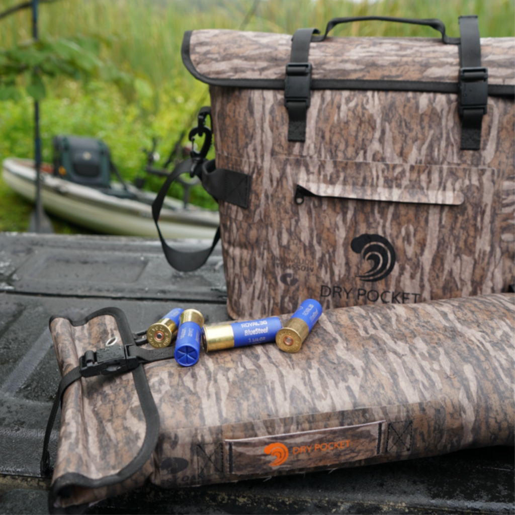 Camo dry bags with shotgun shells, ideal for hunting and outdoor gear storage in wet conditions